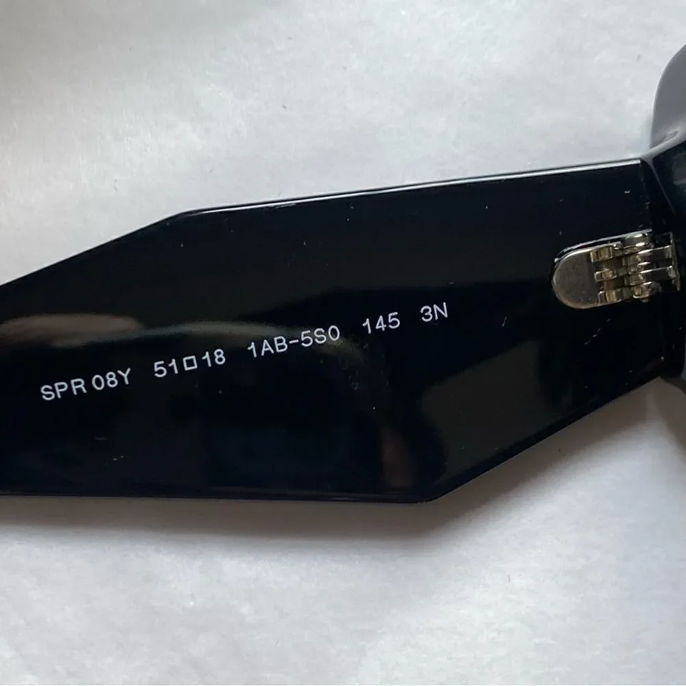 Prada Eyewear black square frame sunglasses logo sides Revolve in case $489